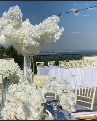 a table with a bunch of white flowers on it at Вила Белисима, Villa Bellissima in Kara Agach