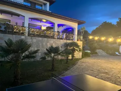 a house with a ping pong table in front of it at Вила Белисима, Villa Bellissima in Kara Agach