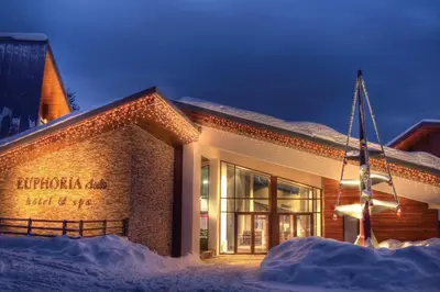 a building with a flag in front of it in the snow at Large One Bedroom Flat - Mountain Bliss in Borovets