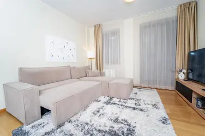 a living room with a couch and a tv at Large One Bedroom Flat - Mountain Bliss in Borovets