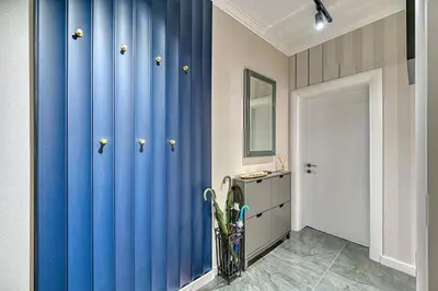 a hallway with a blue curtain in a room at A new sense of home in Sofia