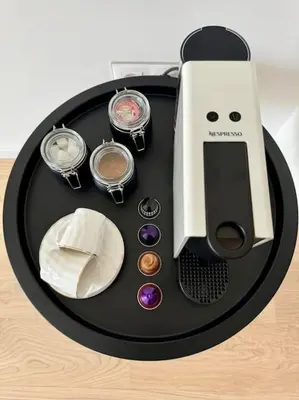 a table with an iphone and cosmetics on it at The Urban Pearl in the Heart of Sofia next to National Palace of Culture in Sofia