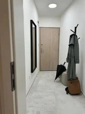 a hallway with an umbrella and a suitcase at The Urban Pearl in the Heart of Sofia next to National Palace of Culture in Sofia