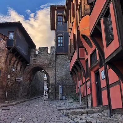 an alley in an old building with an archway at Apartamento Violette OLD Town Plovdiv in Plovdiv