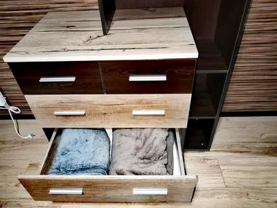 a wooden dresser with a drawer in a room at Апартамент за гости в Пампорово in Pamporovo