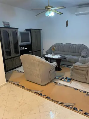 a living room with a couch and a table at Лунара in Sandanski