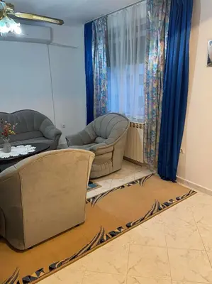 a living room with two chairs and a couch at Лунара in Sandanski