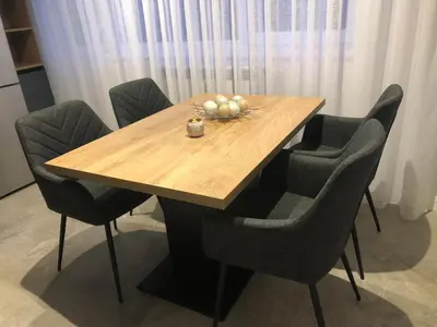a wooden table with chairs and a bowl of fruit on it at Stylish 2BDR apartment Gramada, free parking in Sofia