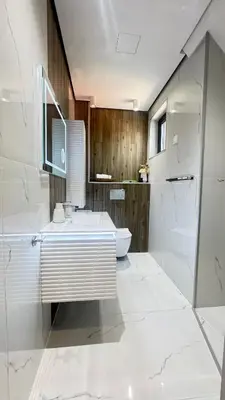 a white bathroom with a sink and a toilet at Grandma Anni's House in Plovdiv