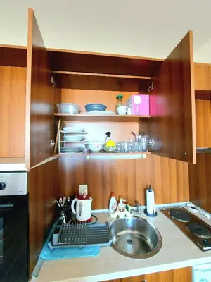 a kitchen with a sink and a counter top with a sink at Vihren Palace Residence, close to Gondola lift,211 in Bansko