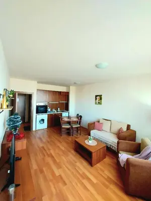 a living room with a couch and a table at Vihren Palace Residence, close to Gondola lift,211 in Bansko