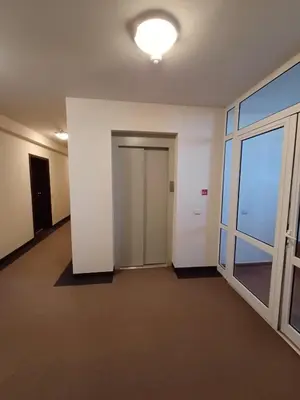 an empty room with a door and a window at Apartment Melania in Complex Royal Towers in Bansko
