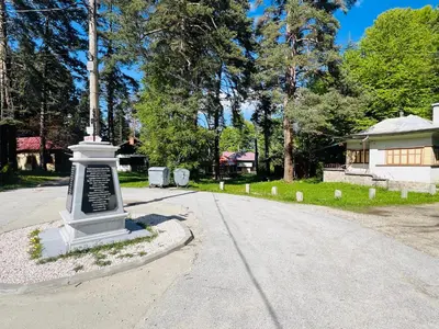 a monument in the middle of a street at Фокс Хаус FOX HOUSE in Peshtera