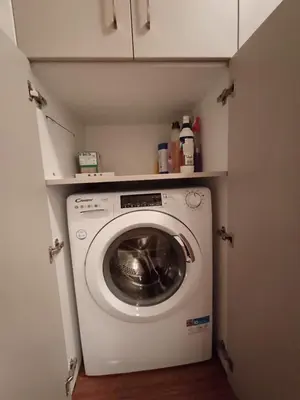 a washer and dryer in a small room at Apartment Melania in Complex Royal Towers in Bansko