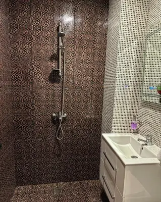 a bathroom with a shower and a sink at Вила Тиара in Stoykite