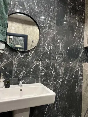 a bathroom with a sink and a mirror at Green Paradise - Luxurious Apartments in Plovdiv
