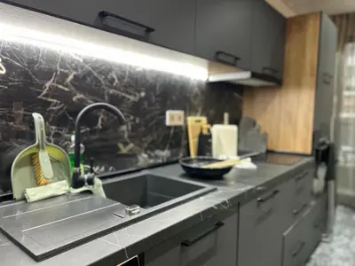 a kitchen with a sink and a counter top at Green Paradise - Luxurious Apartments in Plovdiv