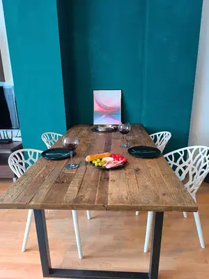 a wooden table with a plate of fruit and wine glasses at Botanique - Cozy stay with free Bottle of Wine in Bansko