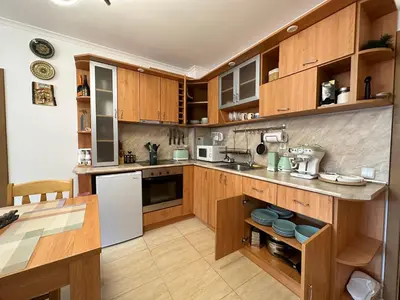 a kitchen with wooden cabinets and a white refrigerator at Mountain View, Grand Monastery Pamporovo, top location in Pamporovo