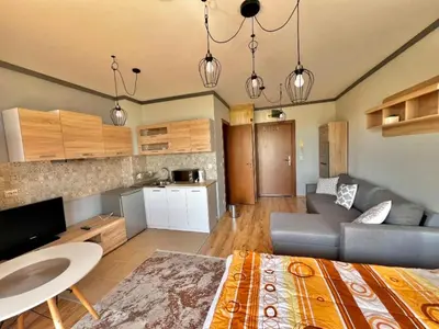 a living room with a couch and a table at St Ivan Ski and Spa Studio in Bansko