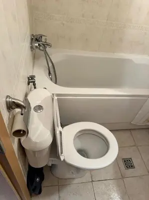 a bathroom with a toilet and a bath tub at Cozy apartmen with Mountain view in Bansko