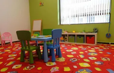 a childs play room with a table and two chairs at Cozy apartmen with Mountain view in Bansko