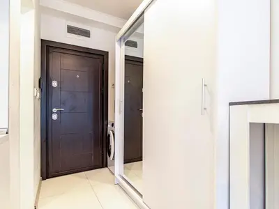 a hallway with a door and a mirror at Stay Inspired - Sofia Retreat in Sofia