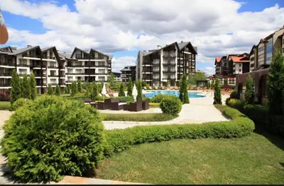 a resort with a swimming pool and some buildings at Aspen golf & Ski resort 2 bedroom apartment E002 in Razlog