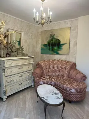 a living room with a couch and a dresser at Ellie Soe Apartment Free parking 5 min to Metro in Sofia