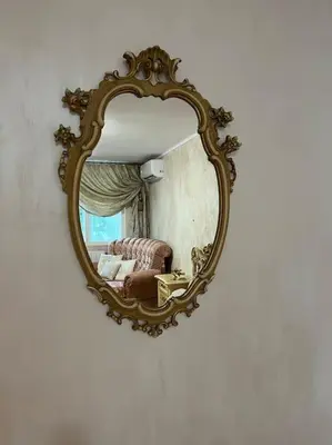 a mirror on a wall with a bed in a room at Ellie Soe Apartment Free parking 5 min to Metro in Sofia