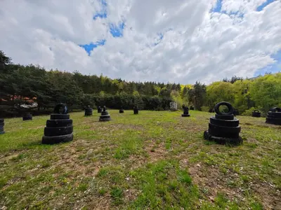 a field with black objects in the grass at Вила Горски Кът in Yavrovo
