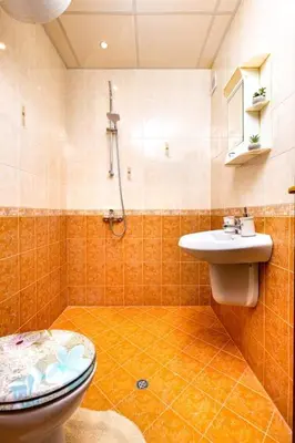 a bathroom with a toilet and a sink at City Center Apartment Aleko Konstantinov in Plovdiv