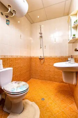a bathroom with a toilet and a sink at City Center Apartment Aleko Konstantinov in Plovdiv