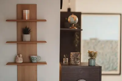 a room with wooden shelves with plants and a mirror at Apartment Rhea with Terrace & Parking in Plovdiv