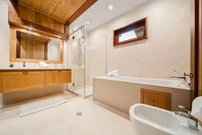 a bathroom with a tub and a sink and a shower at Bansko Lux Villas for Ski & Chill in Razlog