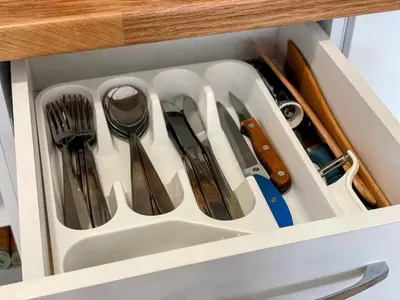 a drawer filled with utensils in a cabinet at One-bedroom Apartment at Belvedere Holiday Club Complex in Bansko