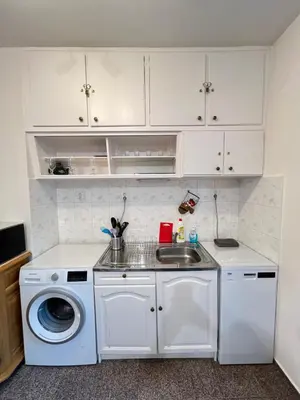a kitchen with a sink and a washing machine at Glasgow 2BDR peaceful Apt 1 min from Metro w WiFi in Sofia
