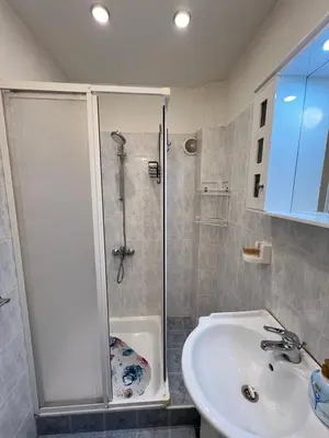 a bathroom with a shower and a sink at Glasgow 2BDR peaceful Apt 1 min from Metro w WiFi in Sofia