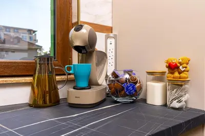 a counter top with a blender and other items on it at Two bedroom apt Karavelov with Private Parking Medical University in Plovdiv
