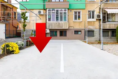 an empty street with a red arrow on it at Tiny Secret Place next to MU with Private Parking in Plovdiv