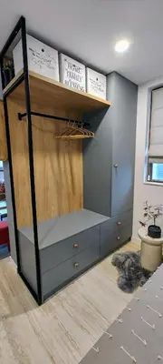 a room with a shelf with books on it at Leaf apartment in Blagoevgrad