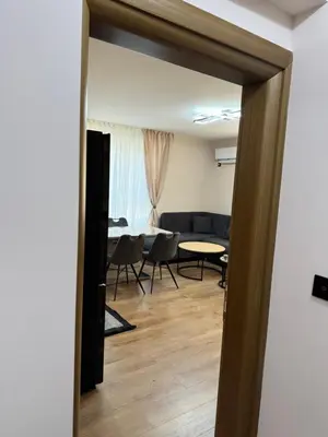 a view of a living room with a table and chairs at Патилови in Sandanski