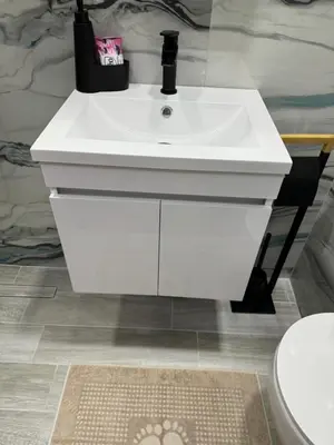 a white sink in a bathroom next to a toilet at Патилови in Sandanski