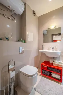 a bathroom with a white toilet and a sink at iLonka's Home 1 BDR with Workspace and Terrace in Sofia