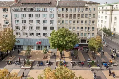 an aerial view of a city street with buildings at The EGO house at Vitoshka Street in Sofia