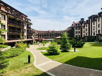 a walkway in front of a large building at Ski Lift - NoVi Apartments Bansko in Bansko
