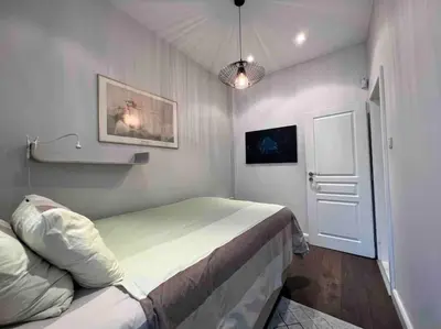 a bedroom with a large bed in a room at Perfectly Sumptuous Centre Apartment, 2-minute walk from Vitosha Boulevard in Sofia
