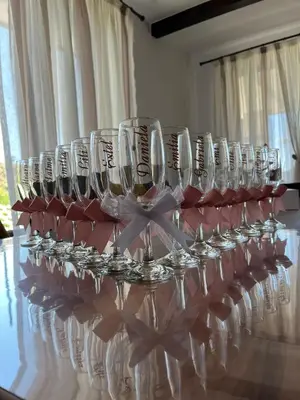 a row of wine glasses sitting on a table at Вила Сънсет 2 in Dospat