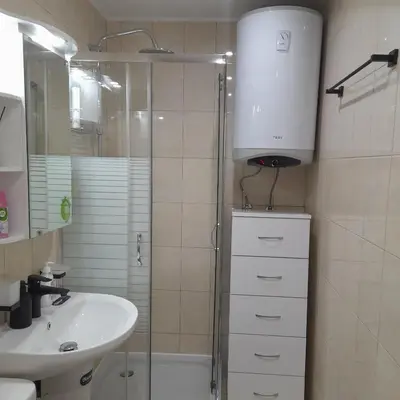 a bathroom with a shower and a sink and a toilet at lux apartament 88 in Bansko