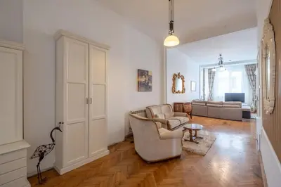 a living room with two chairs and a couch at Aristocratic Elegant 2 BDRM spacious home TOP CENTER in Sofia